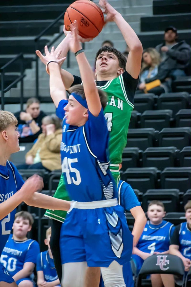 Harlan's Kolbi Green went up for two of his 12 points in the Dragons' win over Rosspoint in the middle school regional tournament on Friday at HCHS.
