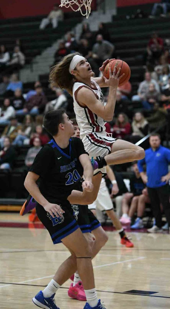 Harlan County senior guard Reggie Cottrell scored 11 of his 25 points in the fourth quarter as the Black Bears rallied for a 69-61 win Monday at Breathitt County.