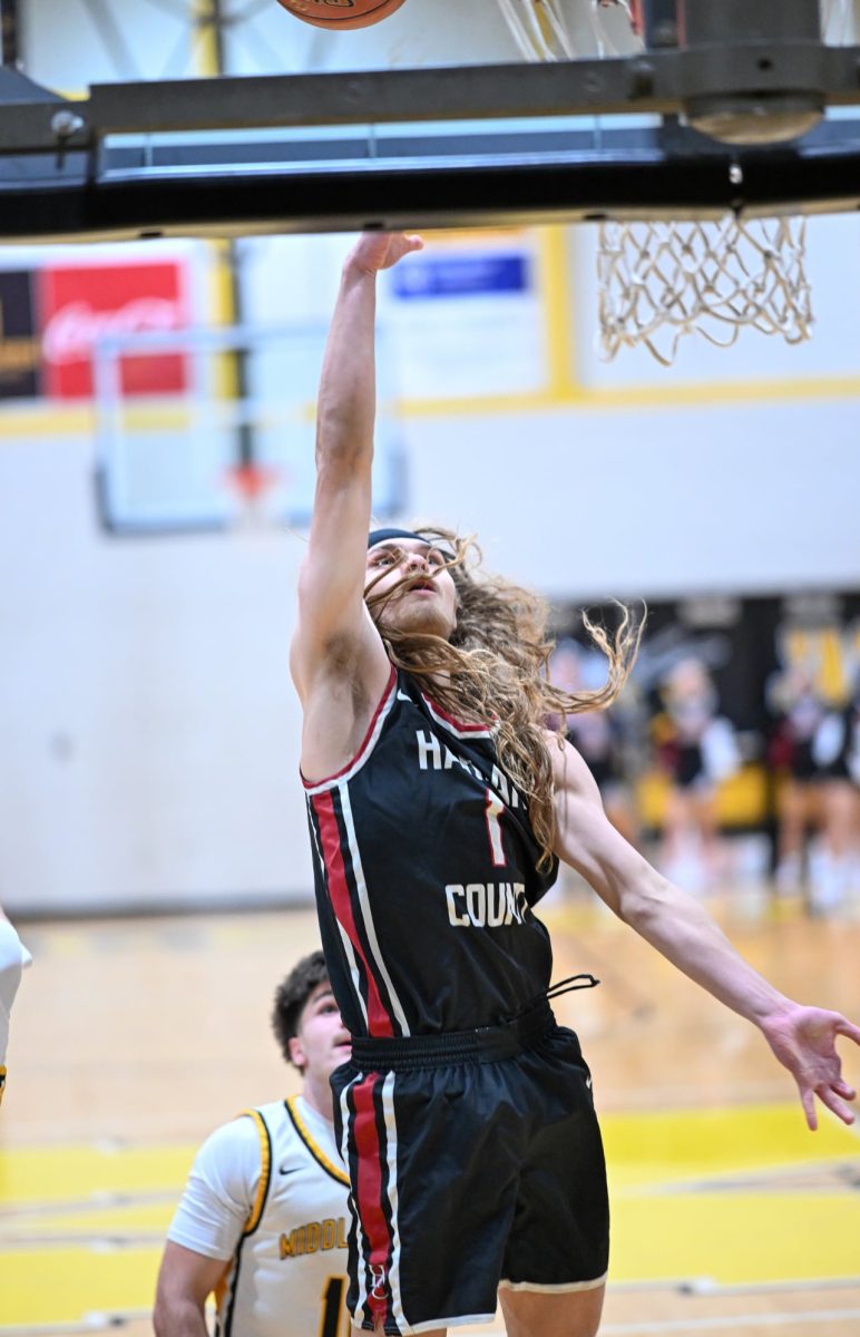 Harlan County senior guard Reggie Cottrell went the basket for two of his 36 points Friday in the Black Bears' 69-61 win at Middlesboro.