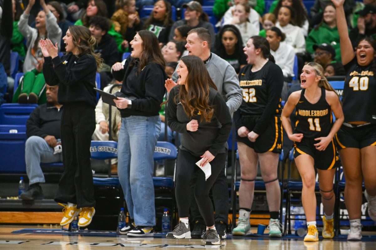 Middlesboro coach Sally Adams (front) and the Lady Jackets celebrated after a big play Monday in their win 45-31 win over Harlan County to break a 14-game losing streak in the district tournament.
