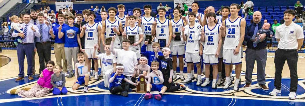 Photo by Jon Dickenson
The Bell County Bobcats are pictured with the 52nd District Tournament championship trophy after a 72-40 win Friday over Harlan.