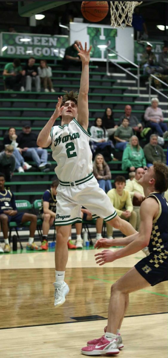 Harlan guard Jaxson Perry went up for a shot in Wednesday's game against Hazard. Perry scored 14 points in the Dragons' 63-56 loss.