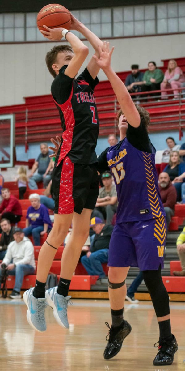James A. Cawood guard Taylor Daniels went up for two of his 11 points in the Trojans' win over Wallins in the semifinals of the seventh- and eighth-grade county tournament Tuesday.