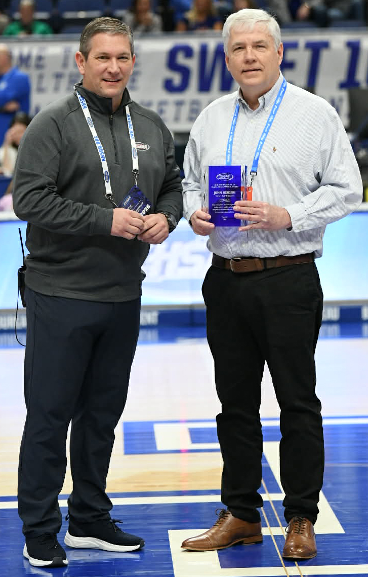 John Henson, the Harlan Enterprise managing editor, was honored Friday as a recipient of the the Bob White/Mike Fields Media Service Award. He received the award from Kentucky High School Athletic Association communications and media relations director Brian Milam. Henson has covered sports in Kentucky for 41 years.
