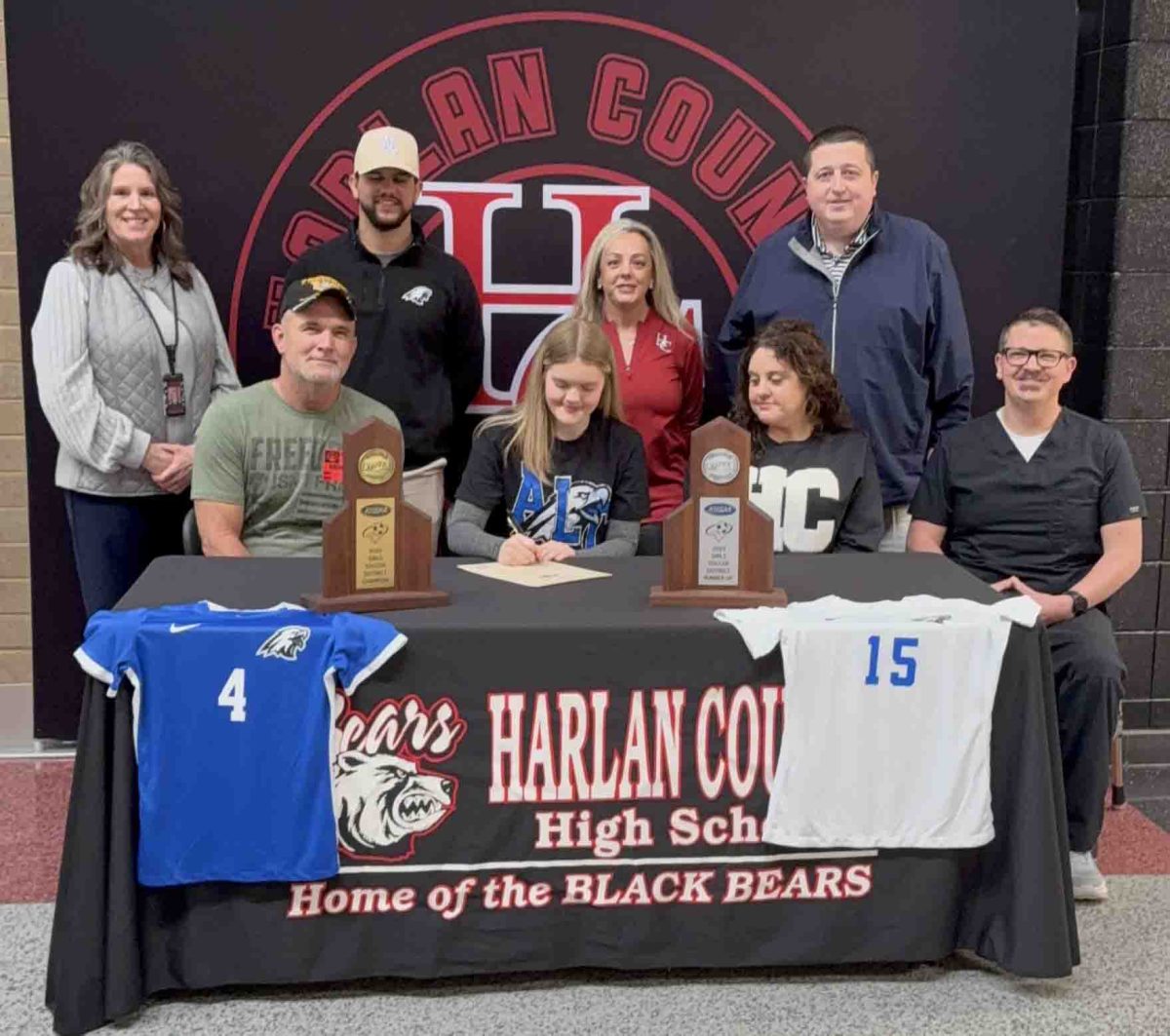 Harlan County High School senior Rileigh Duff signed with Alice Lloyd earlier this week to continue her academic/athletic career. Pictured with Duff are, from left, front row: Mark Duff, Megan Ewing and Charlie Ewing; back row: HCHS Principal Kathy Napier, Alice Lloyd coach Juan Lander, HCHS coach Trish Crider and HCHS athletic director Eugene Farmer.