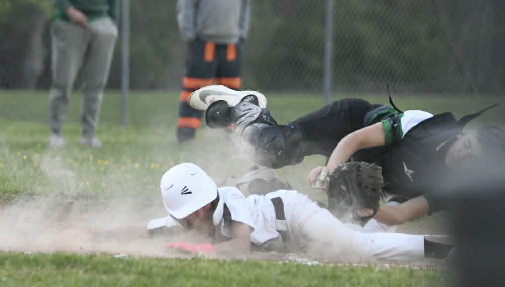Cumberland's Hutton Sherman slid home with a run Monday during the Redskins' 12-2 win in middle school baseball action.
