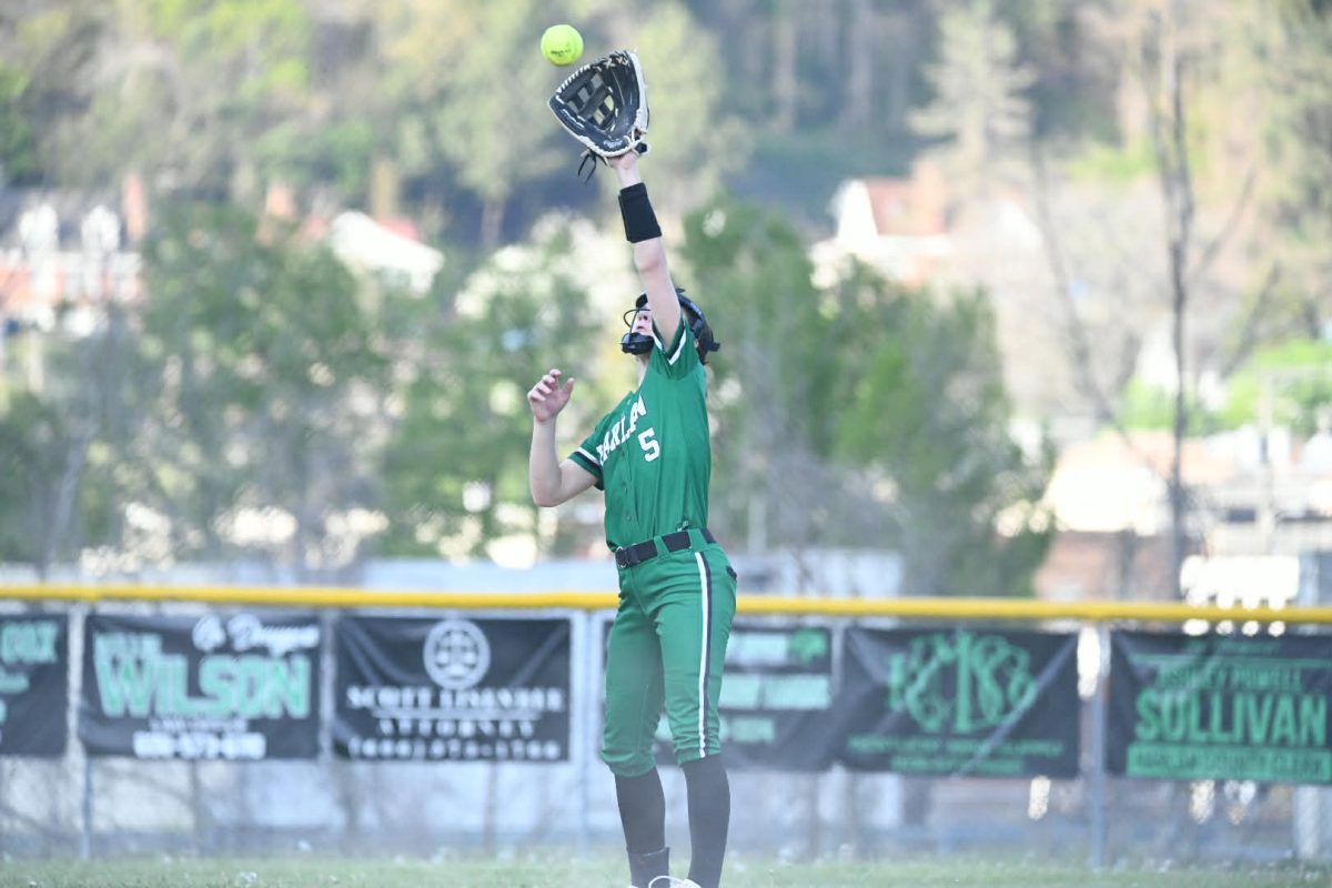 Harlan shortstop Taylor Glenn caught a pop up in Friday's district game against Harlan County. Glenn drove in both Harlan runs with a double in the sixth inning, but the Lady Dragons fell 5-2.