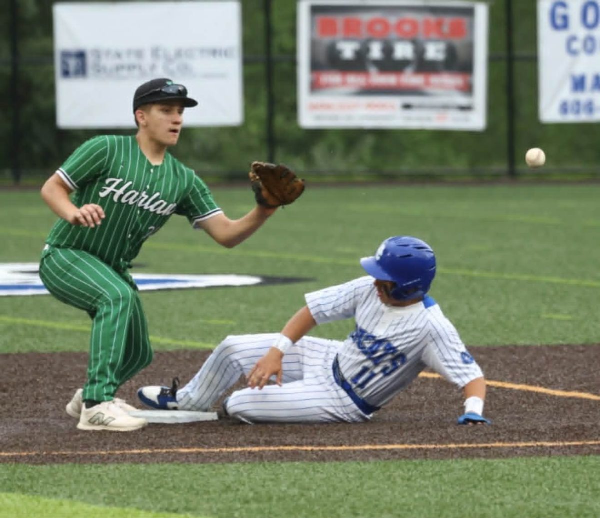 Bell County's Mason Sziksai slid into second base as Caiden Jackson took the throw during Tuesday's district clash against Harlan. Sziksai had three hits in the Bobcats' 7-1 win.

