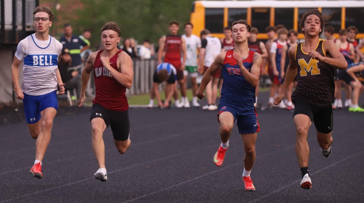 Harlan County junior Jonah Sharp, pictured in action earlier this season, placed fourth in the 100-meter dash and fifth in the 200-meter dash at Magoffin County to help the Bears win the team title.
