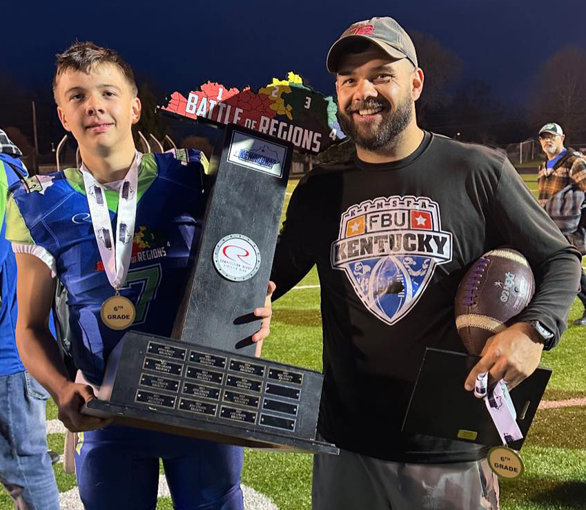 New Harlan County middle school coach T.J. Green is pictured with his son, Kolbi, after winning an all-star game as members of Team Kentucky.