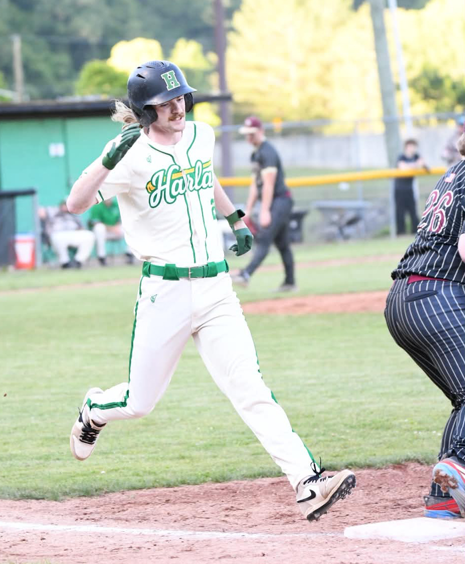 Harlan's Chris Rouse headed to first base in Friday's game against Leslie County.