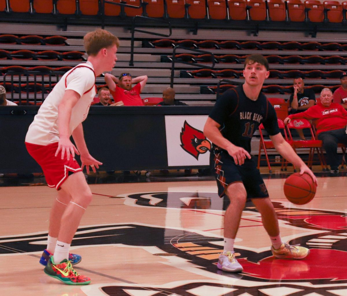 Harlan County junior guard Brady Smith worked against a South Laurel defender in the Bears' opening scrimmages Friday in London. The Cardinals grabbed an early lead on the way to an 81-61 win.