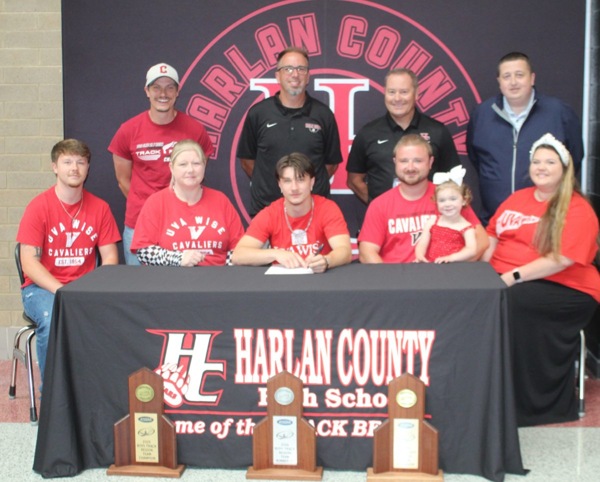 Harlan County’s Jayce Brown signed with UVA-Wise in ceremonies last week at the high school. Those attending included, from left, front row: Jacob Brown, Shonda Brown, Jayce Brown, Christopher Brown, Kennedy Brown and Hannah Brown; back row: assistant coach Jacob Carroll, coach Ryan VItatoe, assistant principal Anthony Nolan and athletic director Eugene Farmer.

