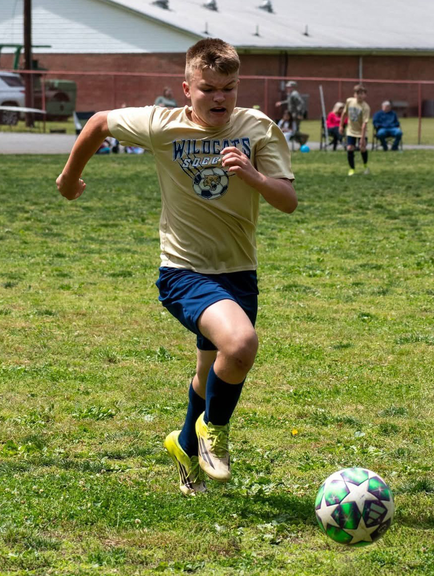Carson Clark sprinted with the ball earlier this season. Clark was one of the leading scorers in the elementary league.