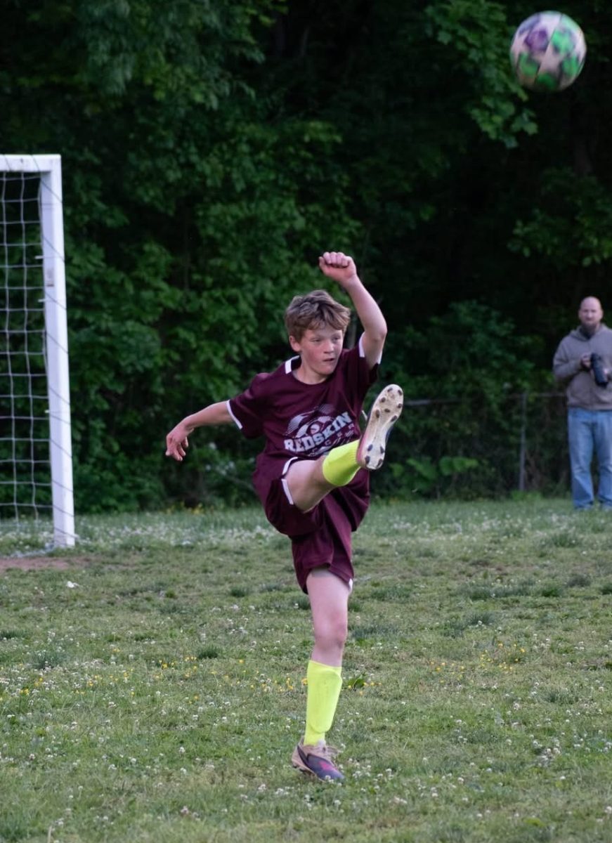 Jake Whitaker kicked the ball down the field in recent county soccer league action.