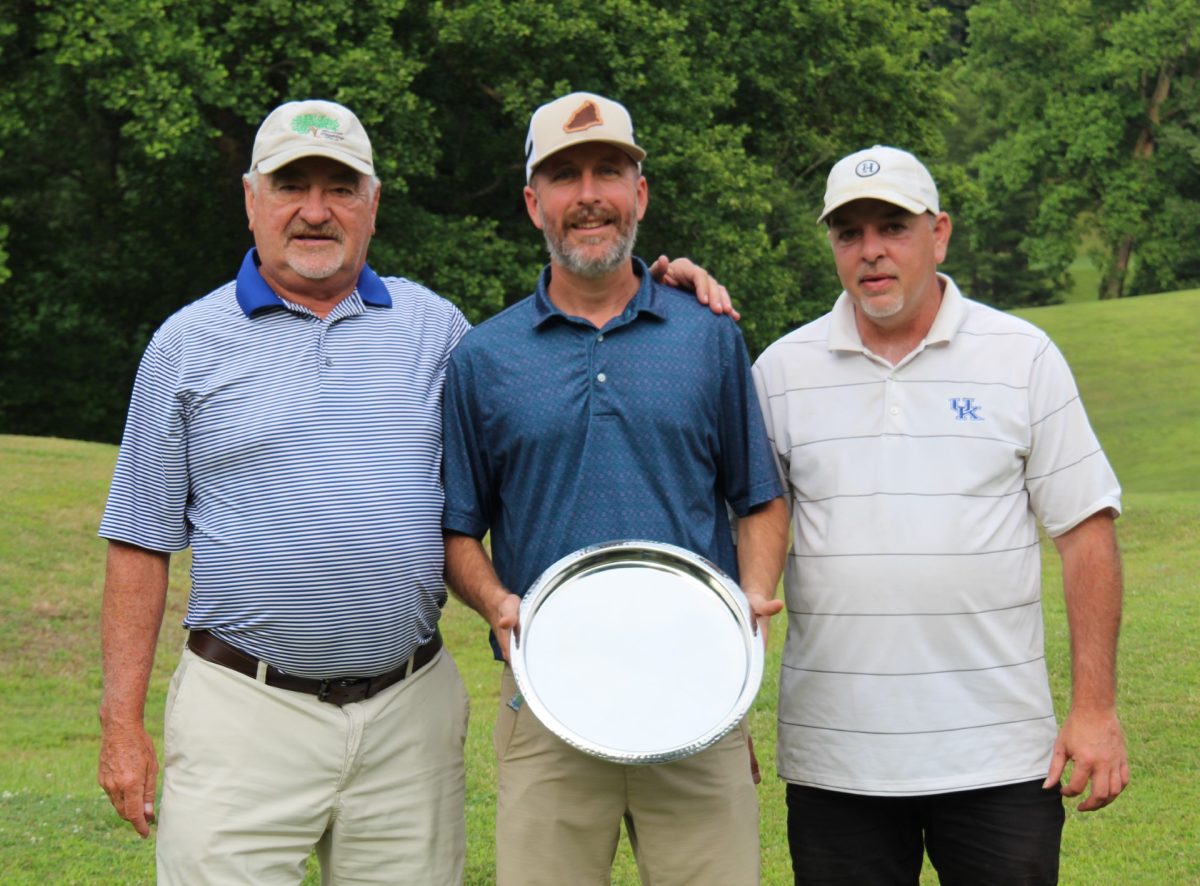 Harlan Invitational champion Matt Gann, of Pineville, is pictured with Harlan Country Club Board of Trustees member Roger Anderson (left) and club president Andrew Forester.
