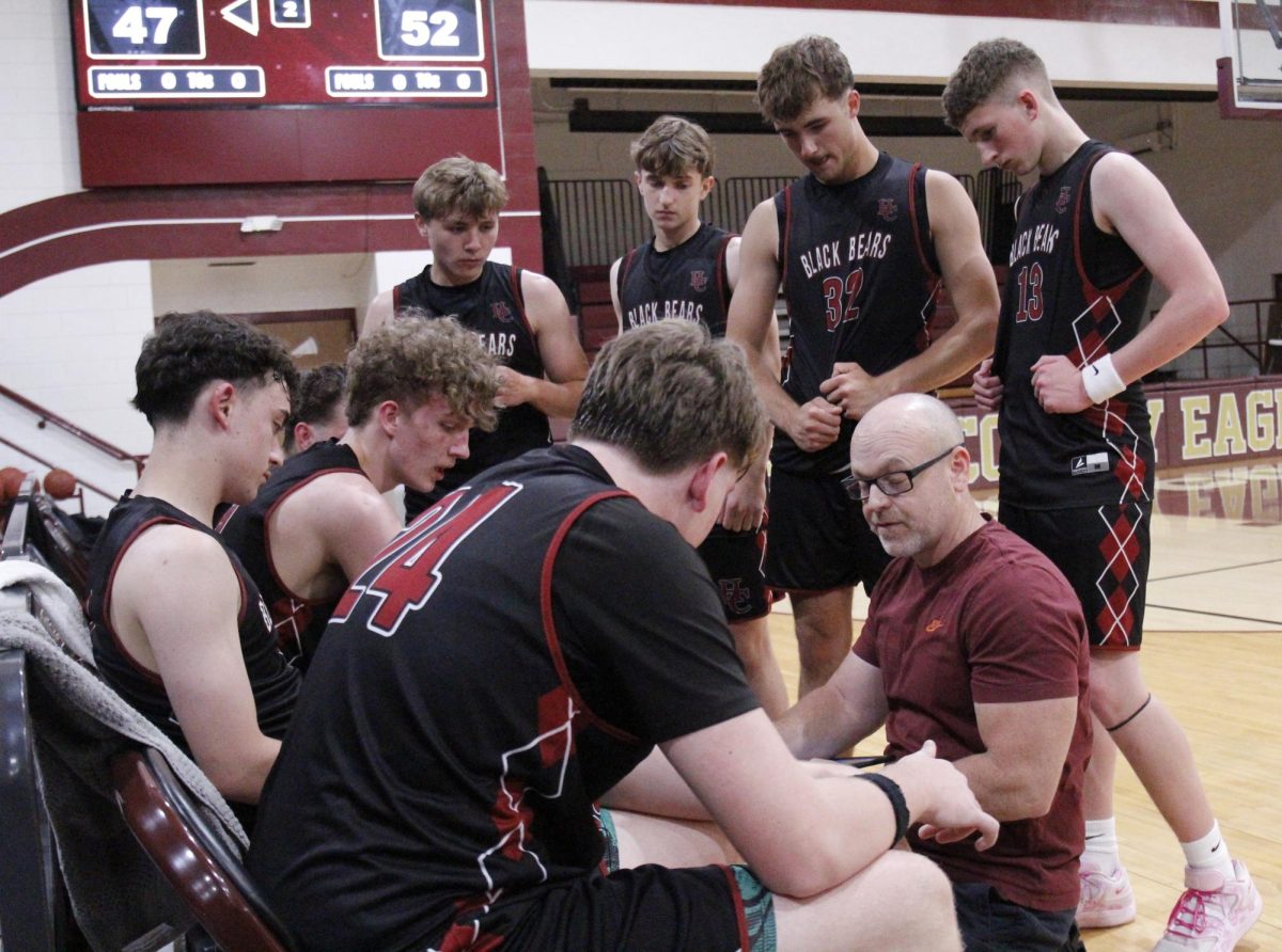 Harlan County coach Kyle Jones talked with his Bears during a timeout in action earlier this summer. Harlan County defeated Knox Central and Whitley County on Monday at Clay County.
