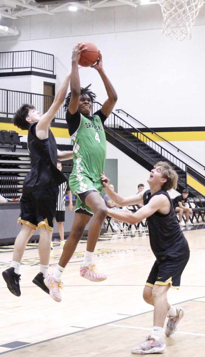 Harlan senior forward Legend Mimes went up for a shot in a scrimmage Wednesday at Clay County. The Green Dragons claimed wins over Clay and Knox Central to improve to 3-1 in summer action.