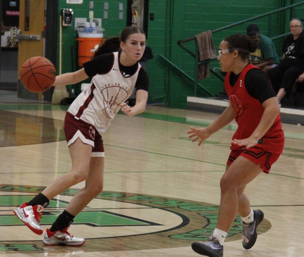Harlan County sophomore guard Reagan Clem drove against a Perry Central defender in summer scrimmage action Thursday. Clem scored six points in a 52-18 victory.