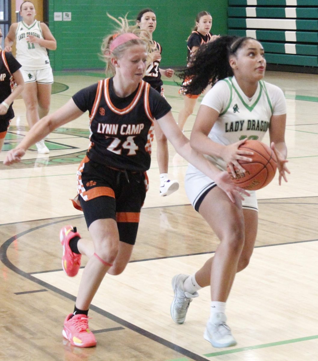 Harlan sophomore guard Talae Taylor drove to the basket in summer action Thursday against Lynn Camp. Taylor led the Lady Dragons with 13 points in a 59-14 win.
