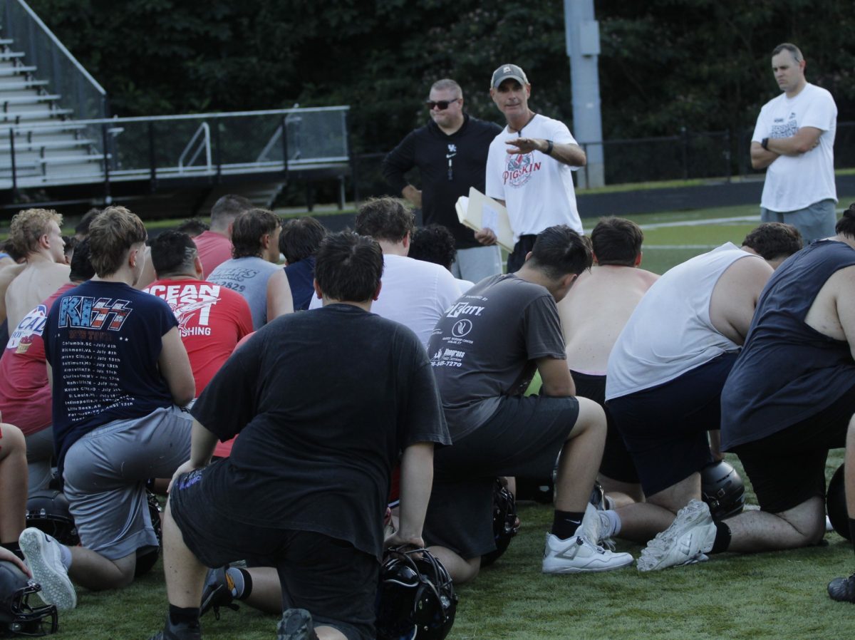 Harlan County coach Jacob Taylor talked with the Bears at the end of practice on Tuesday. The Bears open their season Aug. 22 against Clay County at Corbin.