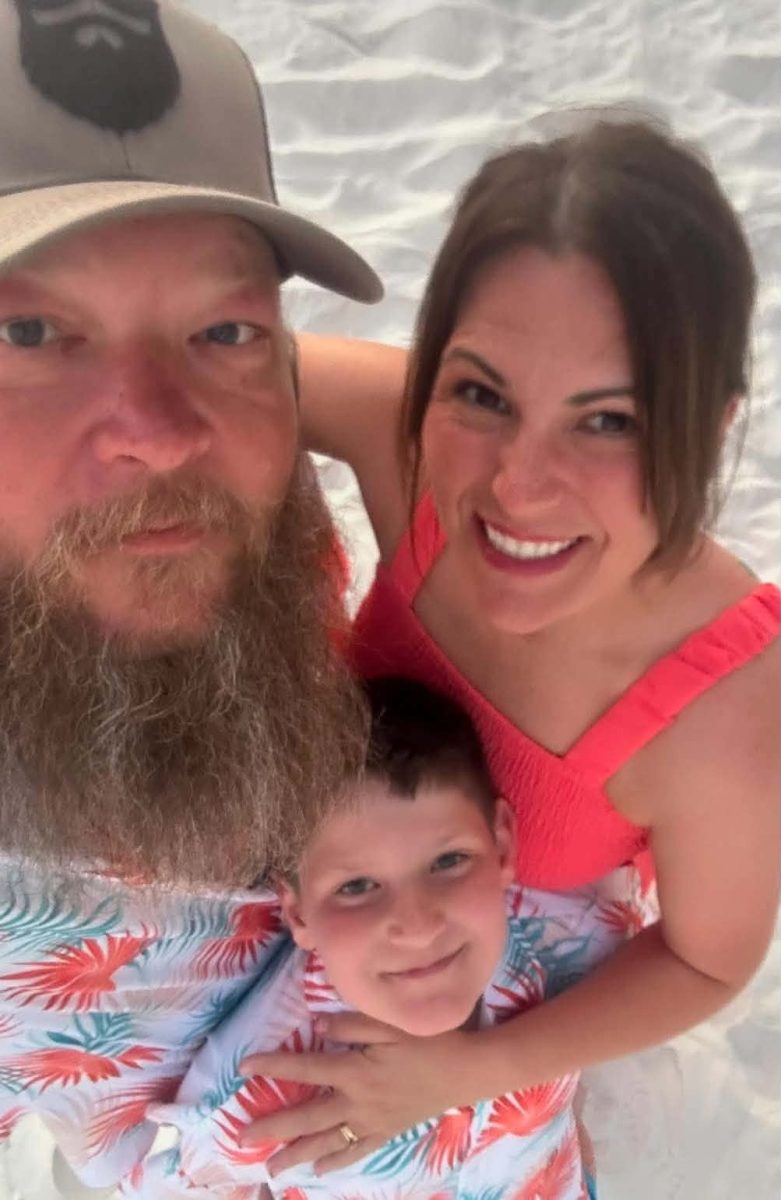Tommy Key (pictured with his wife, Allison and son, Eli) has resigned from his position as Harlan County High School boys soccer coach, citing ongoing health issues.